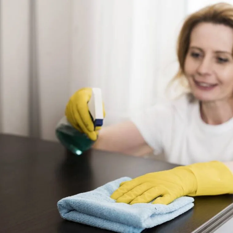 Professional cleaner providing recurring house cleaning service